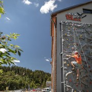 Climbing on the artificial outdoor wall with guide